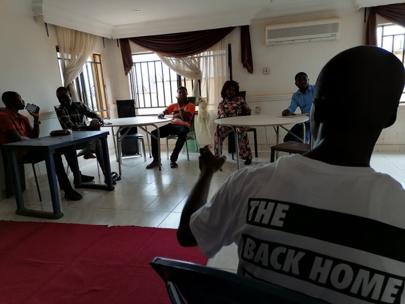 Micheal, an instructor, talks to family and friends of the graduating students